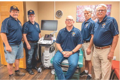 Members of the Knights of Columbus that helped TLC acquire the funds for their new ultrasound machine paid a visit to TLC to see the new machine. From left are Andy McCoy, Bill McDonagh, Steven Sellars, Doug Riles, Gary Wynia. Photo by Bruce Karnick