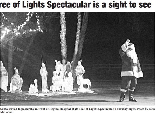 Santa waved to passersby in front of Regina Hospital at its Tree of Lights Spectacular Thursday night. Photo by John McLoone