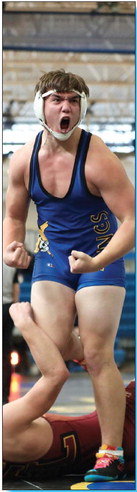 Austin Leflay celebrates his pinfall in the 220-pound match against Forest Lake.Photo courtesy of Sarah Wasvick.See story Page 12