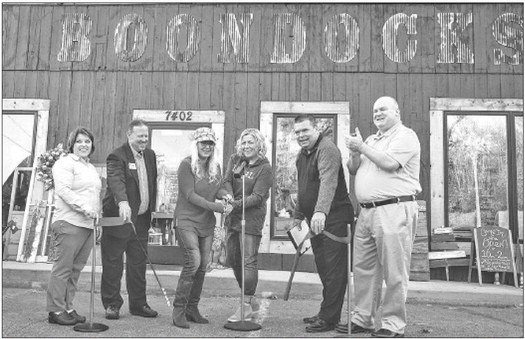 Boondocks Vintage Boutique, a unique gift and repurpose shop has been officially open since the early part of November when (L to R) Senator Karla Bigam, Councilman Steve Dennis, Boondocks Vintage Boutique co-owners Allison Steenberg and Erin Spence, Mayor Myron Bailey, and Councilman Justin Olsen joined the festivities for the Grand Opening. Boondocks features one-of-a-kind gifts from local artisans. If you find something you like, you better buy it right then because it may not be made again. Photo by Bruce Karnick.