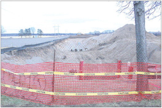 The trunk sewer line now being installed in the southwest corner of town off of Ideal Avenue South is an example of the real world impact of building and tax rates, with building demand rising to the southwest and elsewhere in Cottage Grove. Photo by Joseph Back.