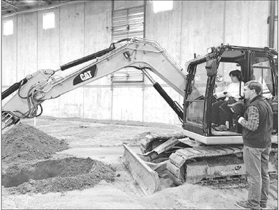 Senator Karla Bigham receives heavy equipment training recently at the IUOE Local 49 training center in Hinkley, MN. Trade skills are in huge demand and a great opportunity for an awesome career. Photo courtesy of Senator Bigham’s Office.