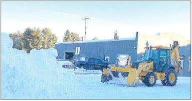 The Village of Boyd snow removal team was hard at it, working to remove piles of snow on Murray Street Monday morning. Friday night’s storm dropped an approximate 8 inches of snow on the Stanley-Boyd area. Photo by John McLoone.