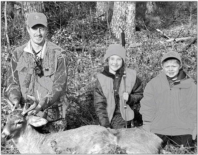 Ryan Moll, Elise Mianecki, and Jordan Moll enjoying opening day of Wisconsin deer gun season.