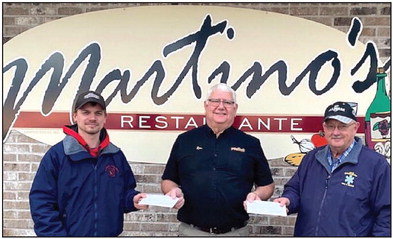 Flanked by Stanley Fire Chief Korey Hagenson (left) and Boyd-Edson-Delmar Fire Chief Ron Patten (right), Martino’s Restaurante owner Ron Haas (center) hands over the proceeds from this year’s Pizza and Prevention fundraiser, totalling $8,500 split between the two local departments. Patten has said the Boyd-Edson-Delmar department is looking to purchase tools to cut into metal roofs as such roofs gain in popularity, while Stanley has been raising money towards a replacement brush truck. Submitted photo.