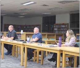 Board members Bob Geist, Ryan Lewallen, and Toni Seidl look on during Monday’s school board meeting.