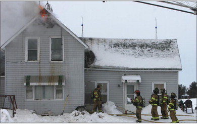 The fire chief offers guidance as crews prepare to enter a town of Cady farmhouse Saturday, Jan. 28. Submitted photo