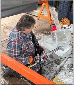An artist worked to create Thor’s Hammer in front of the Port of Prescott at Prescott Winter Fest on Saturday afternoon. Photo by John McLoone