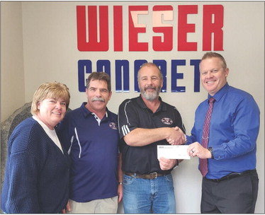 The Plum City Schools would like to sincerely thank Wieser Concrete for their generous donation of $7,500 to the Digital Sign Campaign. The goal of the project is to improve communication and promote the schools, local businesses and events in the Plum City area. From left: Tonja Binkowski, Dan Wieser, Andy Wieser, and Superintendent Brian Nadeau.Photo courtesy of Plum City Schools