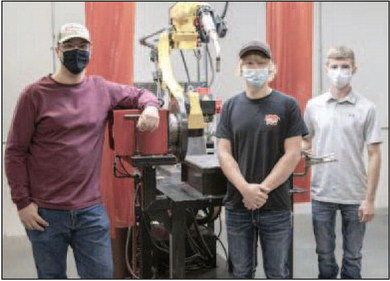 (From left): Andrew Hartman, of Eau Claire, and Ellsworth High School graduates Logan Kilness and Sam Thurmes are second year CVTC welding students. They attended a ribbon cutting in honor of CVTC’s new automated fabrication lab addition. Photo courtesy of CVTC