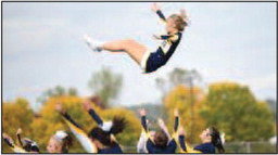 Aspen Sears, of the River Falls High School cheer team, sails into the air, only to be caught by waiting hands below, during Homecoming Week festivities.Photo courtesy of Sue Halling