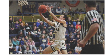 River Falls junior guard Joey Butz drives into the lane for a layup late in the second half during the home game against Eau Claire Memorial on Saturday, Jan. 28. Photo by Reagan Hoverman