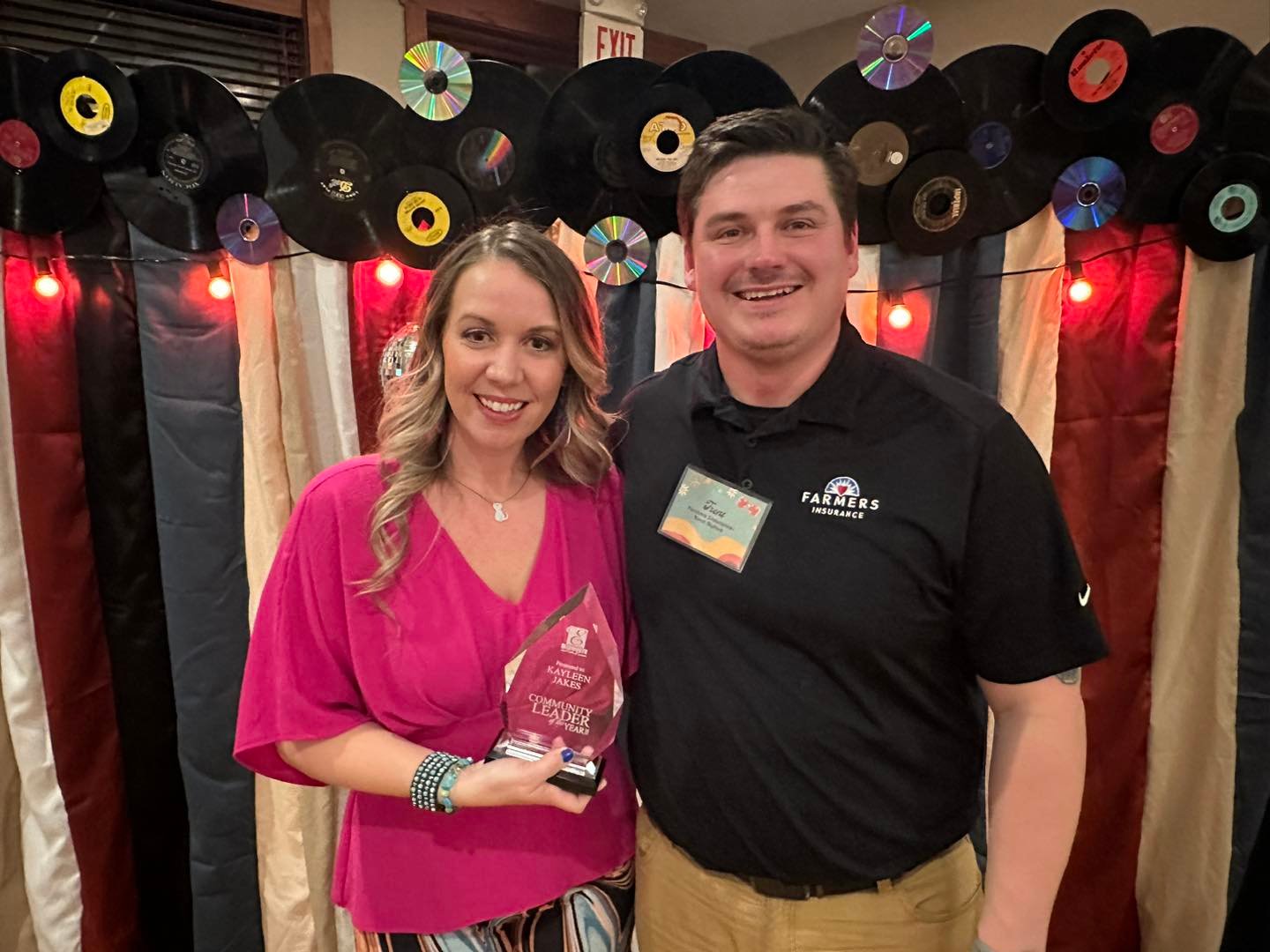 Kayleen Jakes, owner of East End Gifts and Brush Strokes Paint Party, received the Community Leader Award from Ellsworth Chamber Vice President Trent Nyhus at the eighth annual awards banquet at Kilkarney Hills Feb. 20.