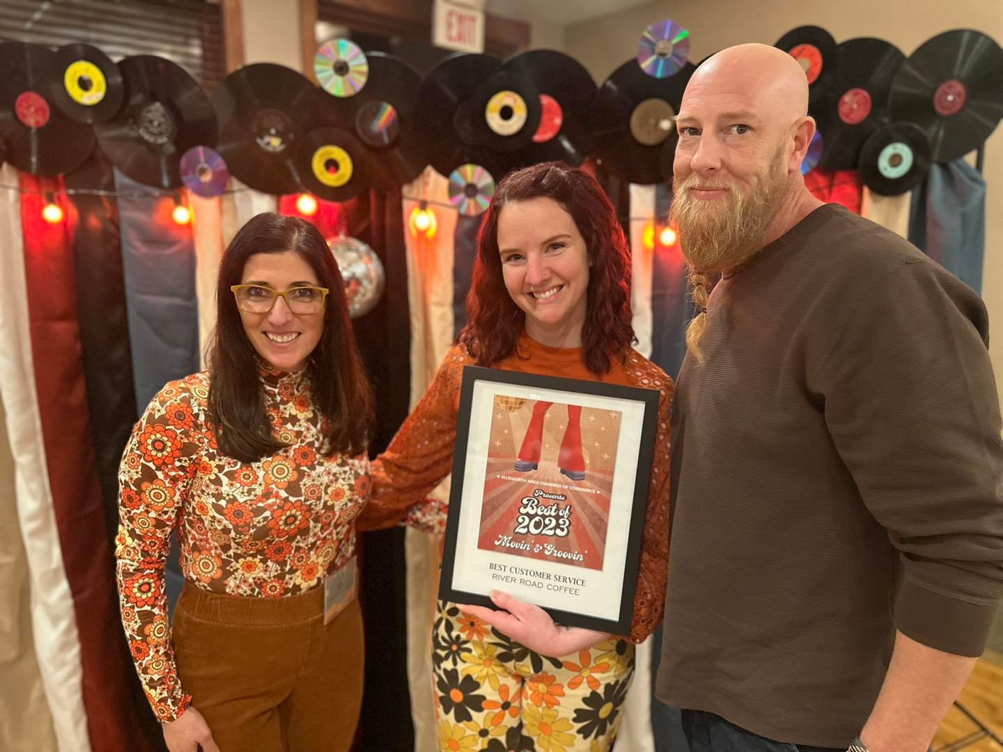 Chamber Board Director Dee Whipple (left) presented the Best Customer Service award to River Road Coffee’s Megan and David Gooselaw, their second win of the night