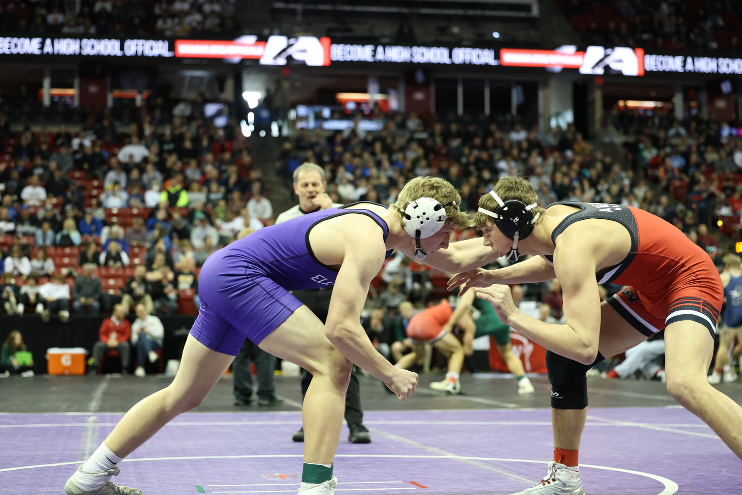 2-24-23 Ellsworth's Anthony Madsen ties up with Amery's Wyatt Ingham at the onset of the 182 pound quarterfinal Friday morning at the WIAA state wrestling tournament...Nate Beier/GX3 Media
