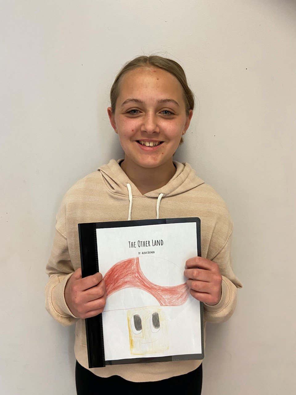 Prescott Middle School sixth-grader Alina Bauman won an award for her short story, called “The Other Land.”
