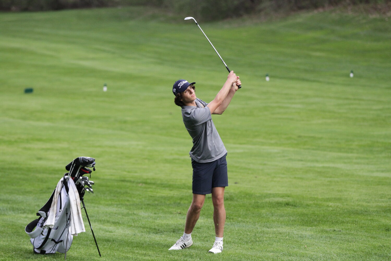 River Falls junior Will Benedict hits a wedge from just off the fairway during a home meet earlier this year. Benedict shot a level-par round of 72 at the Division 1 regional at the Wild Ridge Golf Course in Eau Claire on Tuesday, May 23.
