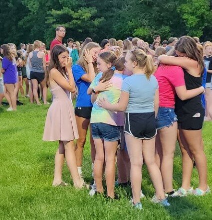 Area students grieve the loss of their friend, Simon Loga, at the Elmwood prayer vigil Wednesday, May 31. Payton Bleskacek died two days later.