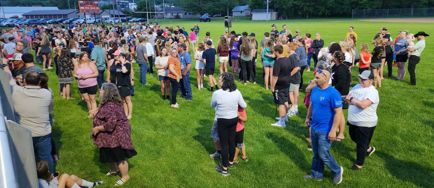 The Elmwood football field was full of people grieving and praying Wednesday, May 31.