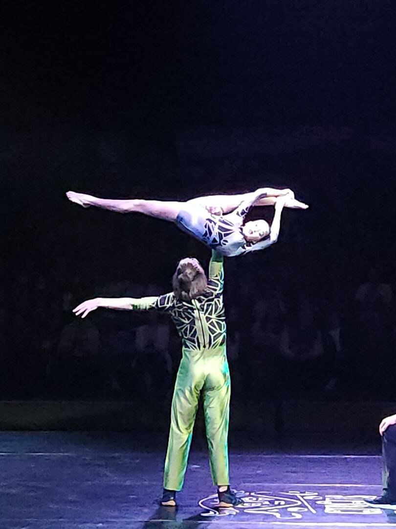 Aidan Bowman performing a hand-to-hand act with his partner at the spring Circus Juventas 2023 show.