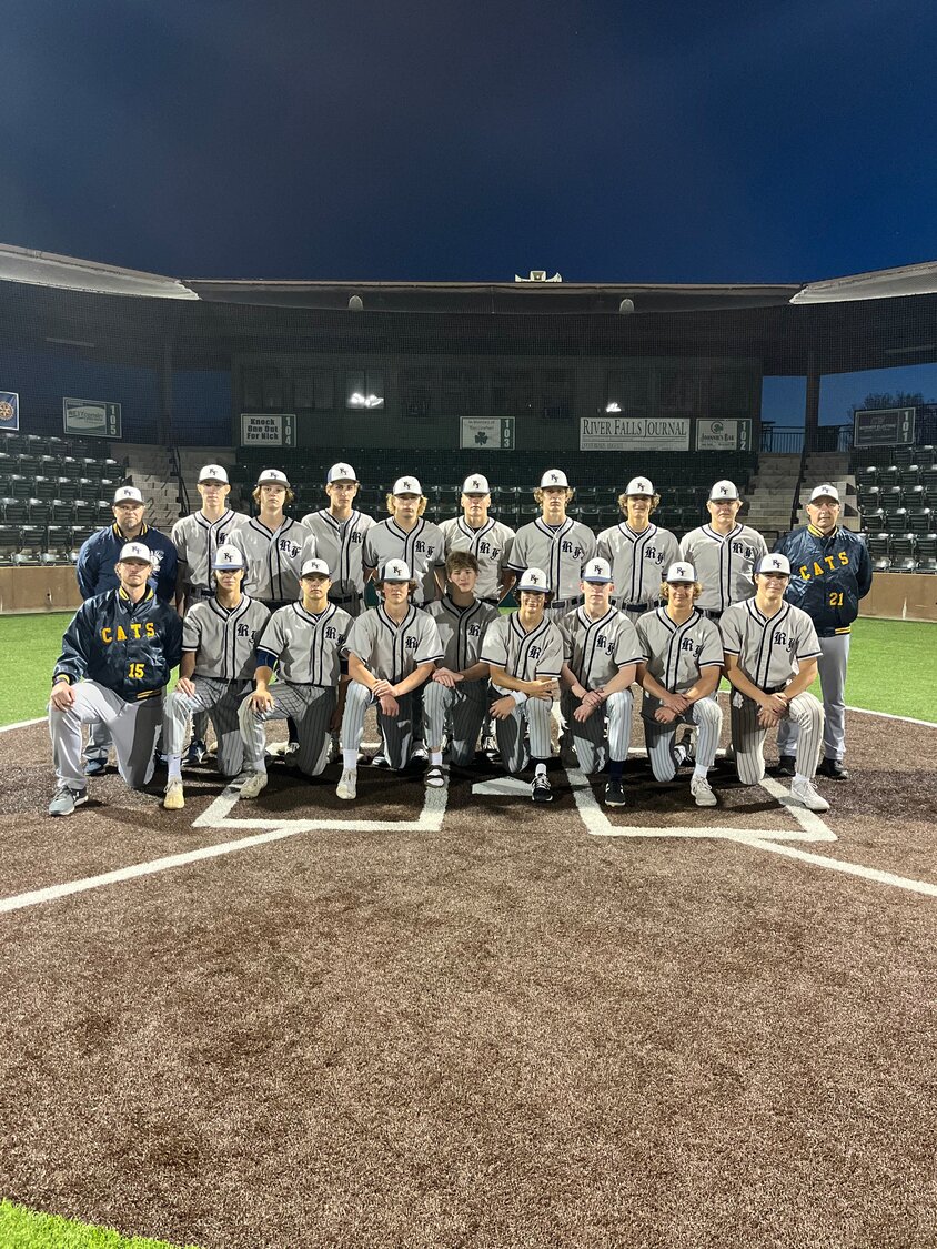 The River Falls High School baseball celebrates together after winning a game last summer. Starting in the spring of 2025, the Wildcats will share the First National Bank of River Falls Field with the UWRF baseball team.