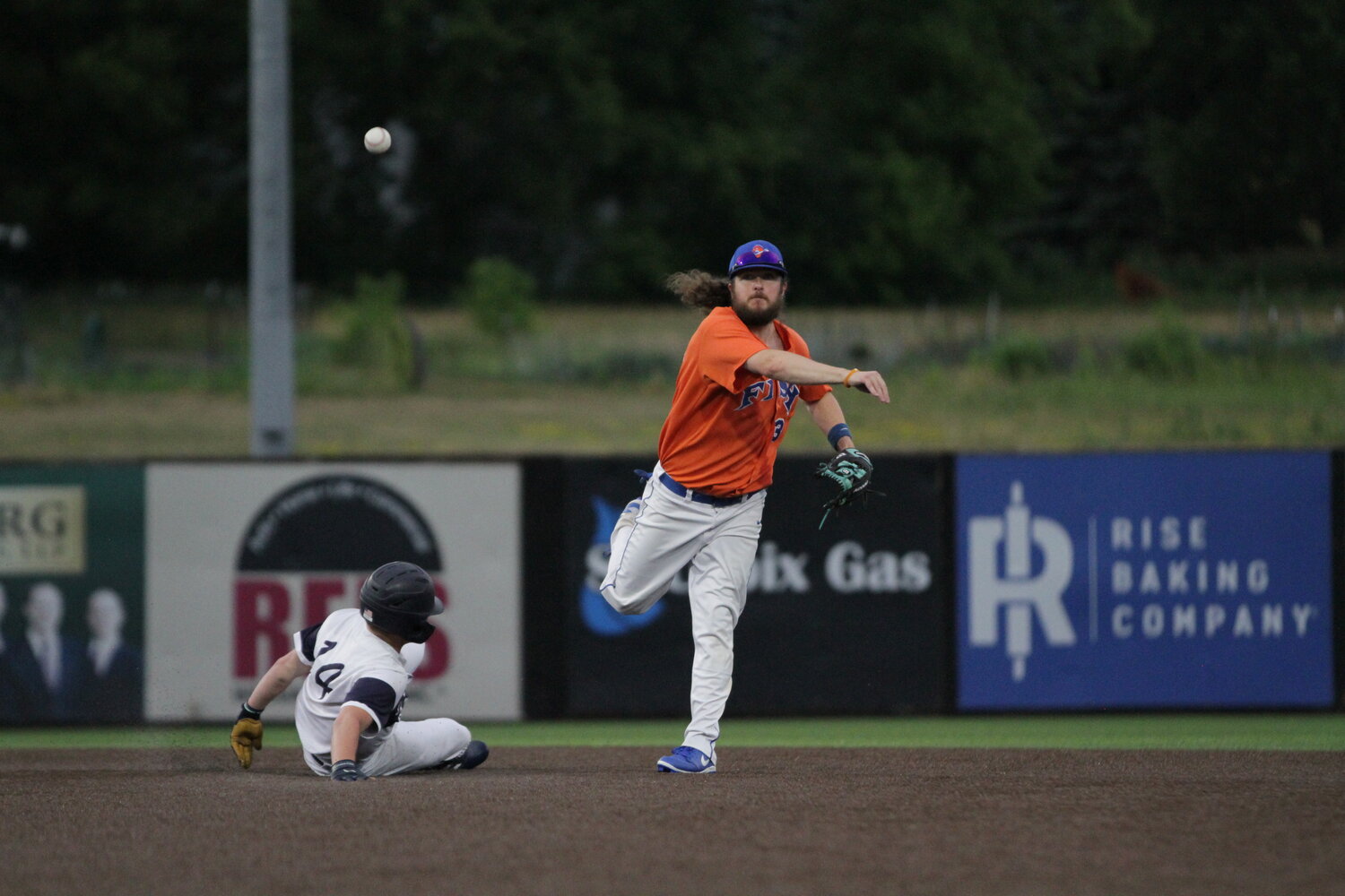 River Falls Fighting Fish utility player Matt Bacon rifles a ball to first base moments after stepping on second to successfully turn a double play against the Elmwood Expos on Saturday, June 24.