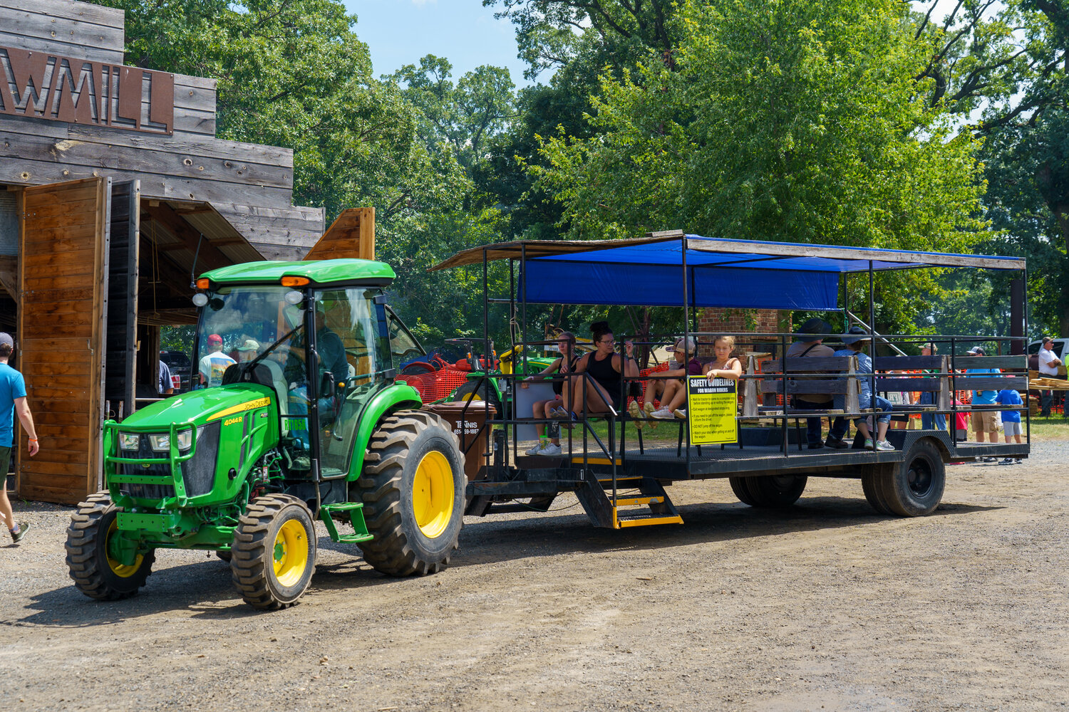 With the size of the property for the Little Log House show, the event organizers offered free tractor pulled wagon shuttles around the grounds.