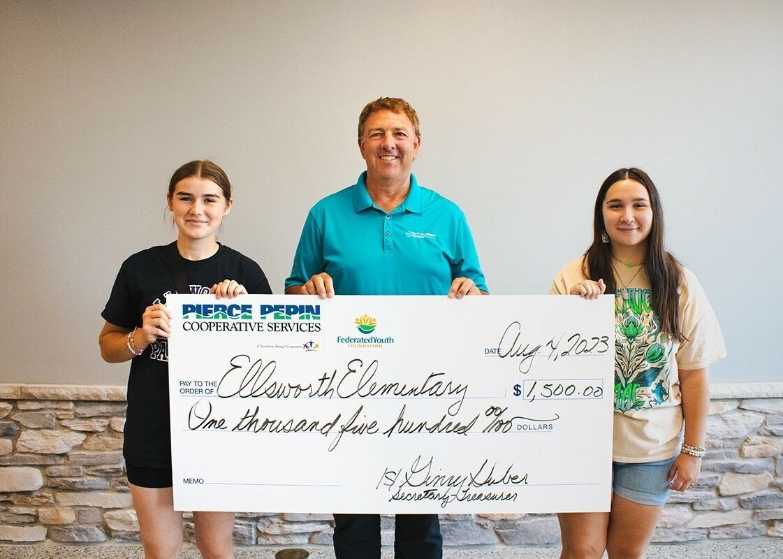 Scott Freier (middle), PPCS Chief Operating Officer, presented a $1,500 check to Maggie Pechacek (left) and Maya Bueso (right) of Ellsworth Elementary School. The check money will be used to help purchase supplies for the school’s fifth annual Back to School Event.