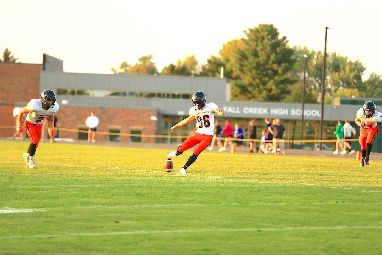 Above, Jesse Allard makes a punt for the Orioles Friday at Fall Creek.