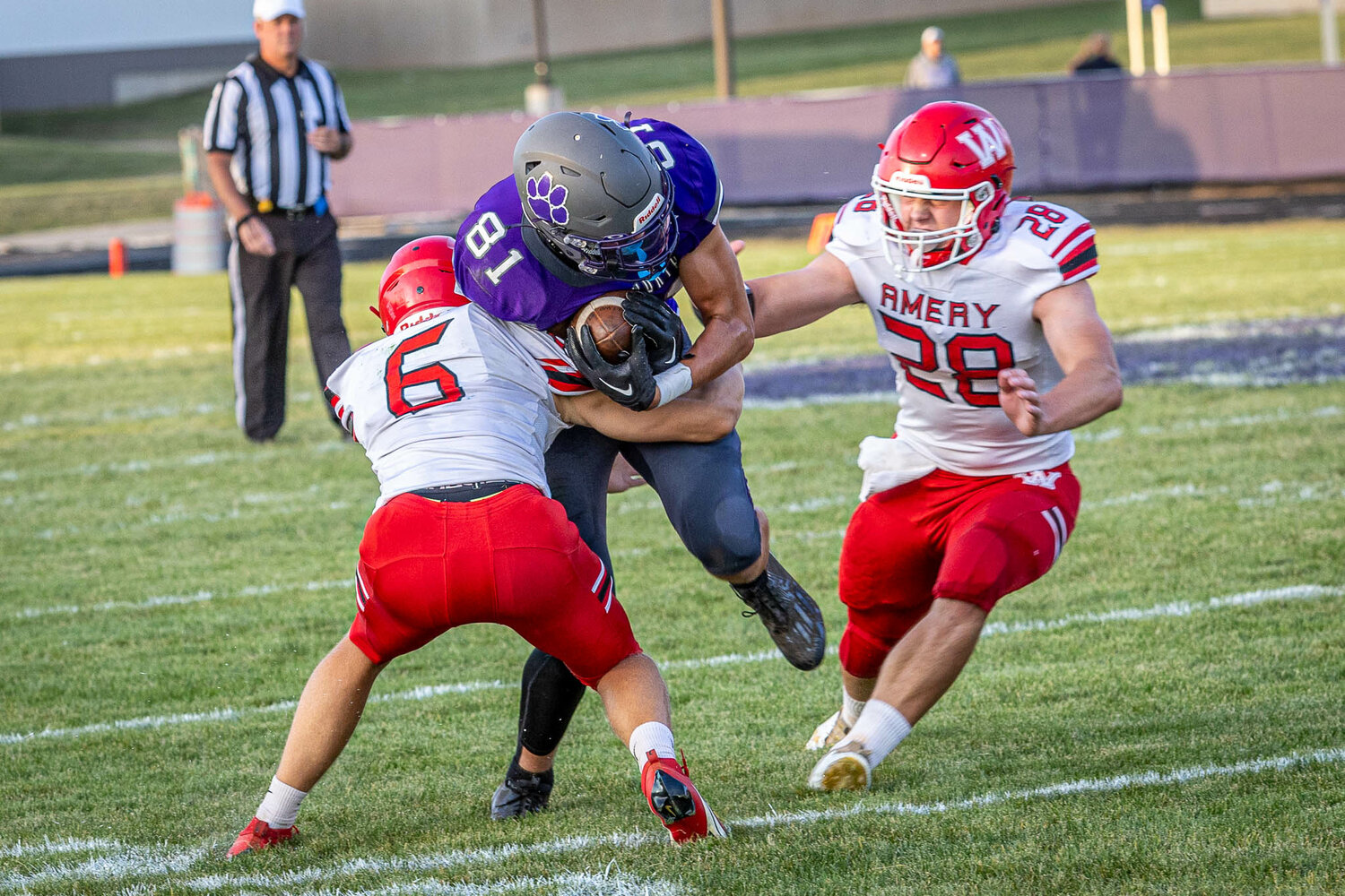 Ellsworth Panthers’ wide receiver George Rohl is tackled by an Amery defender Friday at Fuller Symes Field.