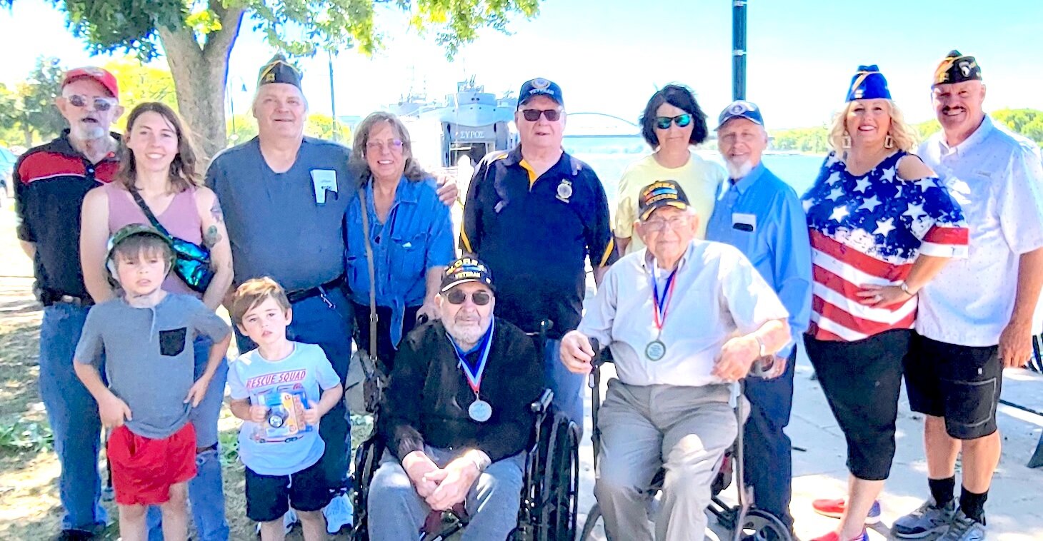 Stanley VFW/ American Legion veterans with family stand in front of the LST325 ship while it was docked on LaCrosse, Wi last week.