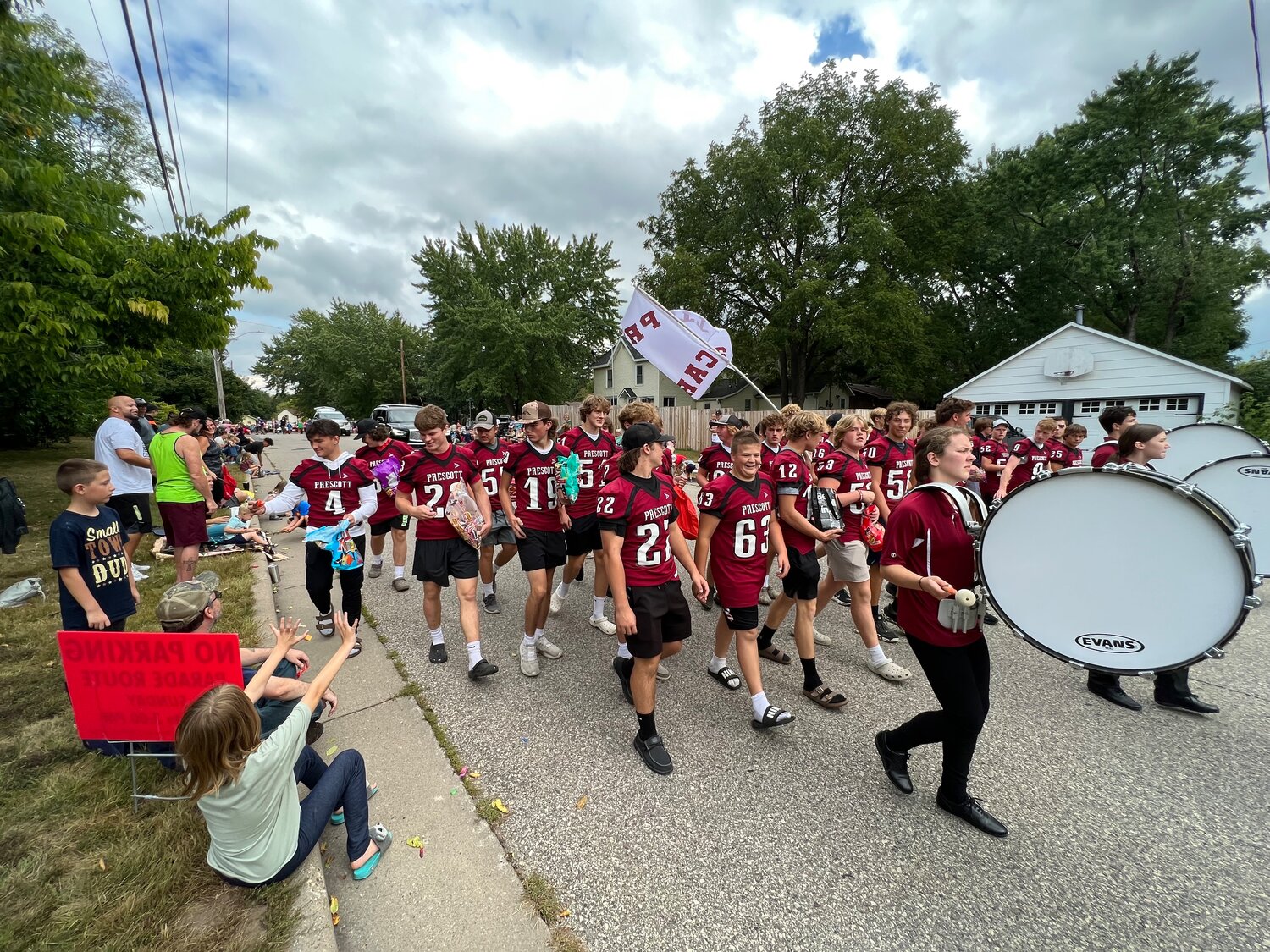 The Prescott Cardinals football team got their Sunday workout in as players marched behind the Prescott High School Marching Band in the Prescott Daze Grand Parade Sunday.