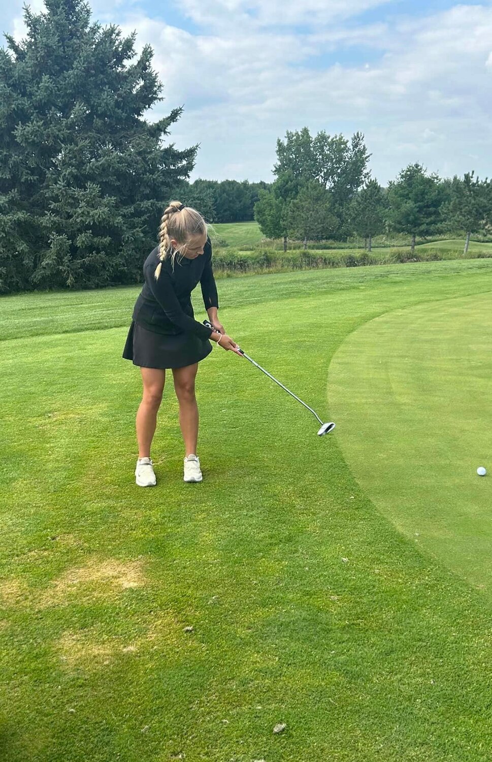 Ellsworth Panther Lexi Marks putting from the fringe of the green.
