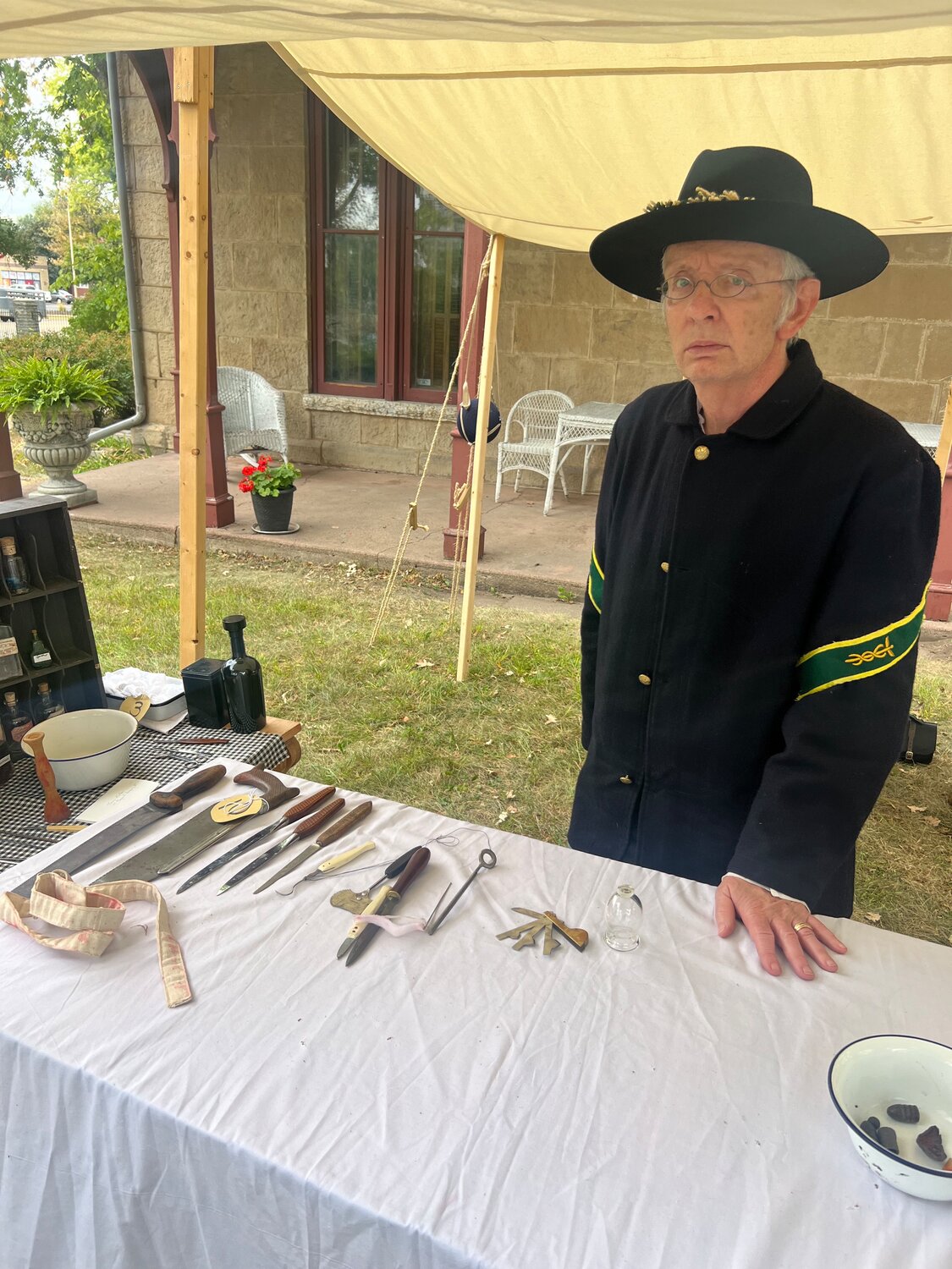 Terry Norton of Rochester “worked” as a doctor in the medical tent as part of the 3rd Minnesota Regiment. Norton explained the tools used to treat soldiers, many of whom faced amputation when ammunition (shown in bowl on right front) pierced their arms and legs. He said many medical advancements came as a result of the Civil War as doctors experimented with various tools and methods to treat injuries and fight infection.