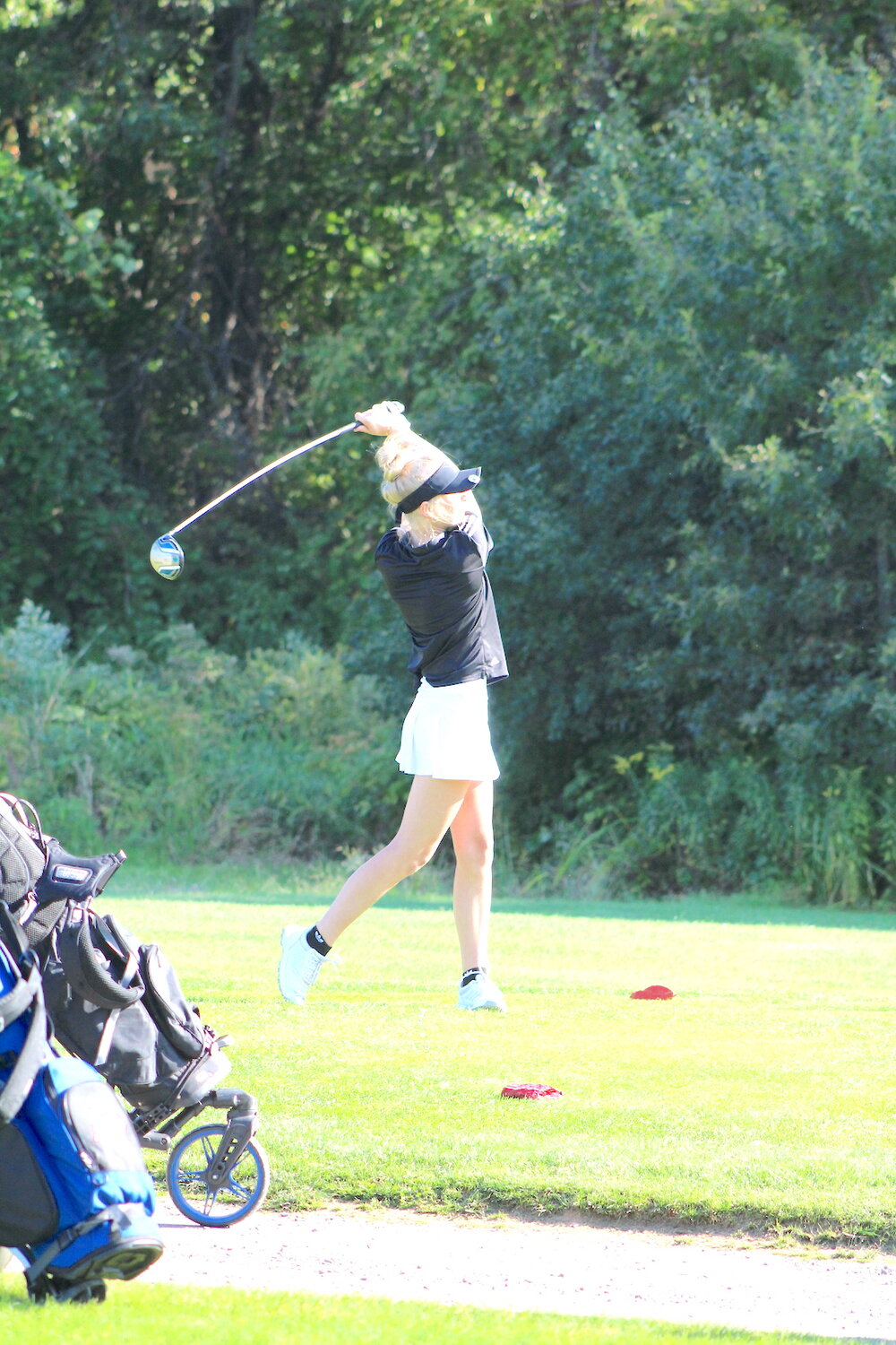 Allie Goodman tees off on hole 10 at Whispering Pines Thursday.