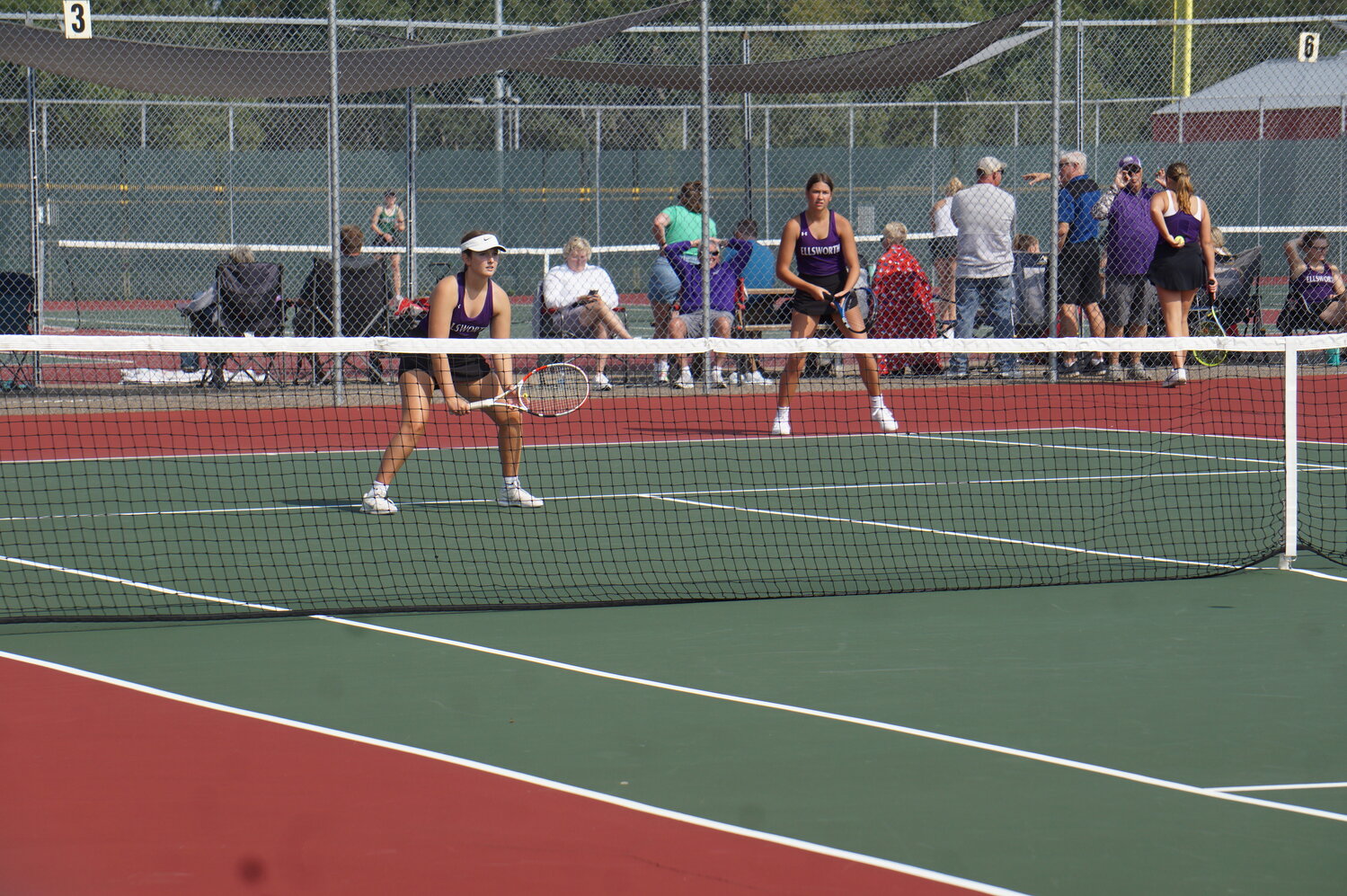 Betsy Foster and Maria Harrington playing doubles in Baldwin-Woodville on Saturday.