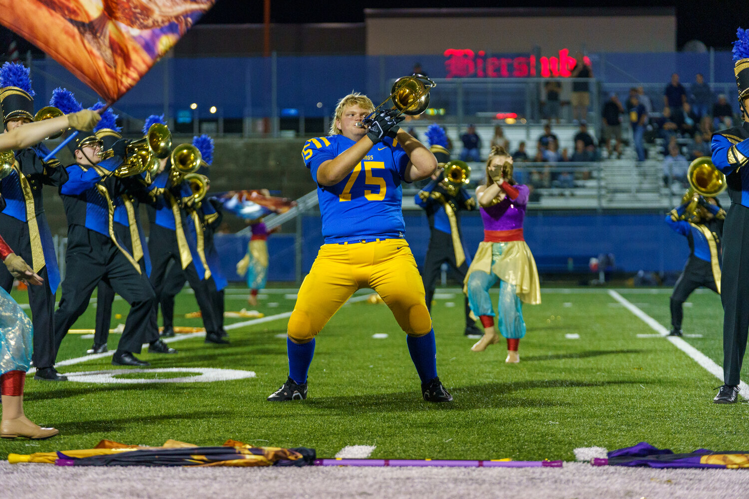 Elliot Renneke was pulling double duty Thursday night at the football game against Mahtomedi. He was there for both football and marching band where he played with his bandmates in his football uniform with the support of his football coaches and band instructors.