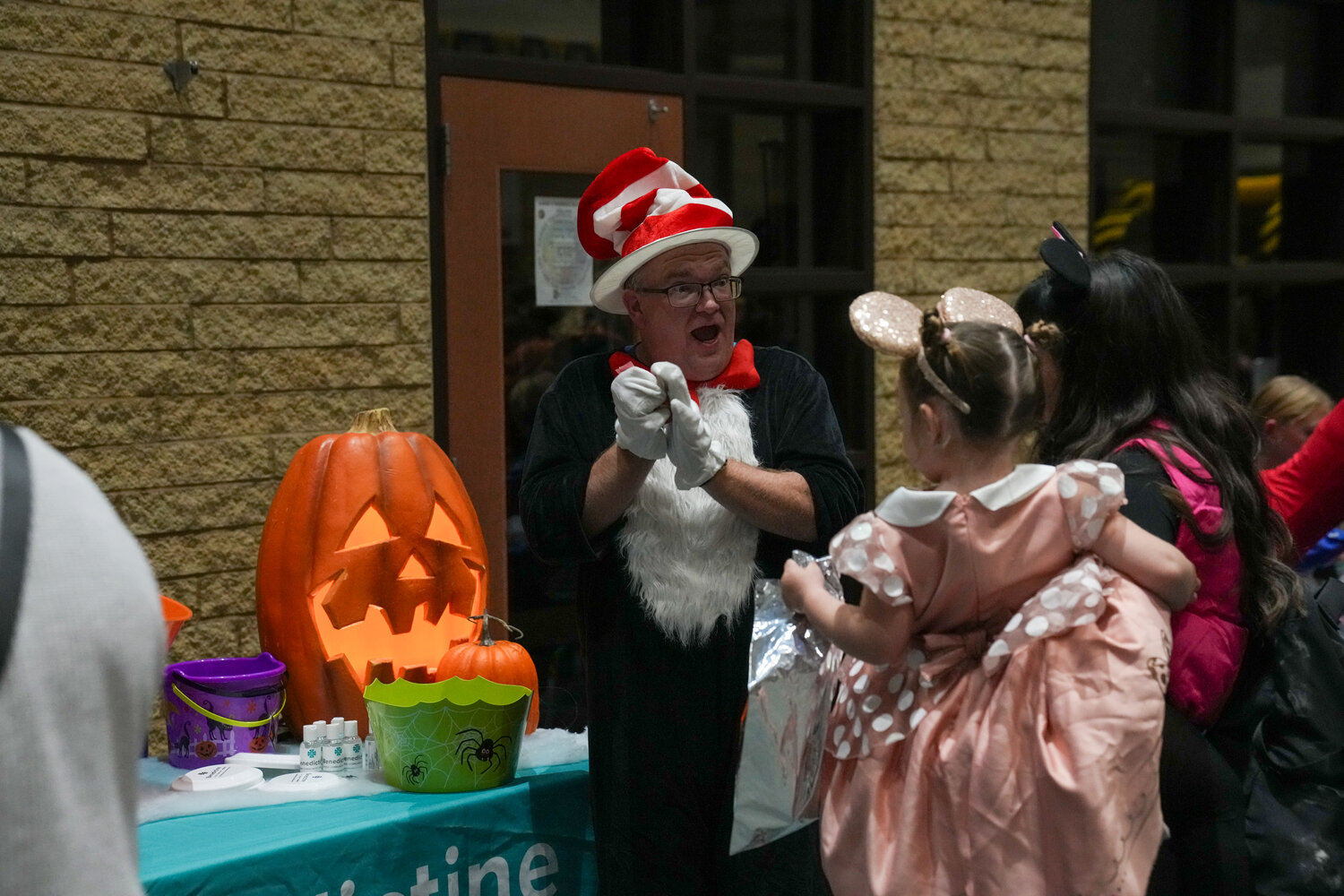 Many of the donors for the Community Halloween Party on Friday set up booths. Here is Rob Halberg of Benedictine Living dressed as the Cat in the Hat having some fun with visitors.