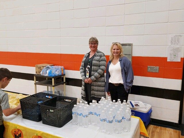 Stanley-Boyd teachers Melissa Long and Lisa Eslinger handed out treats at the Fall Family Literacy Event on Thursday evening.