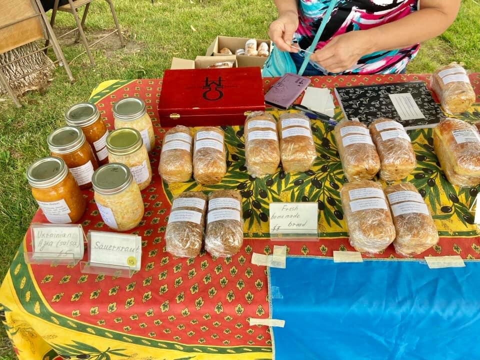 alentyna Benson sells homemade bread, salsa, sauerkraut and more at her farmstand near Roberts and at the Baldwin Farmers Market, raising money to send to her children in Ukraine.