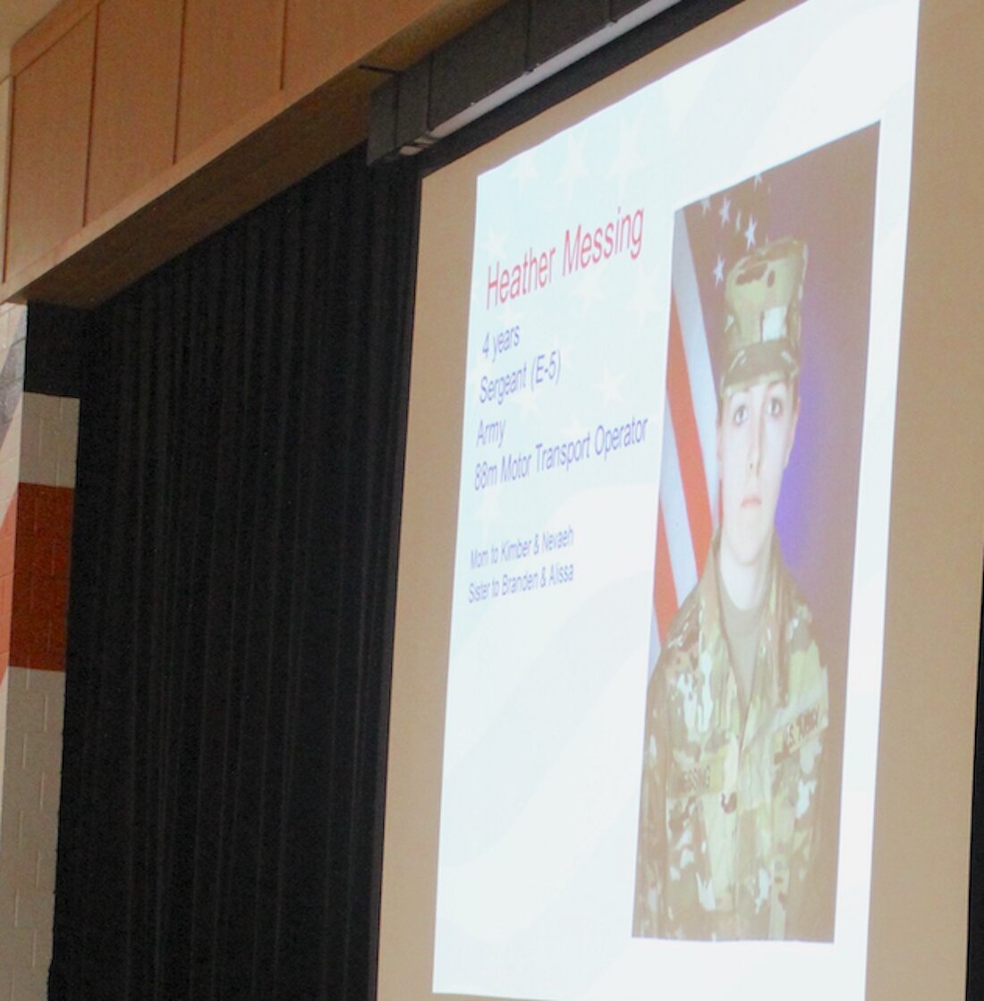 Soldier profiles alternated on the projector screen in the high school gym, often disclosing a family connection to those present.