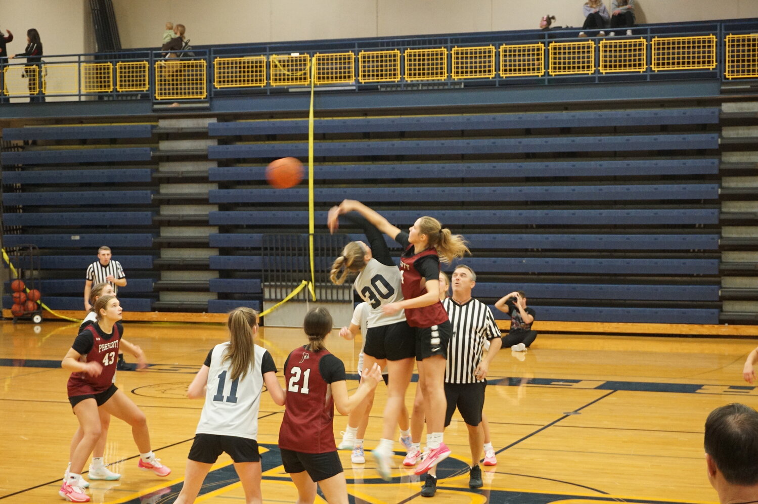 Lila Posthuma wins opening tip off in a scrimmage against the River Falls Wildcats on Friday.