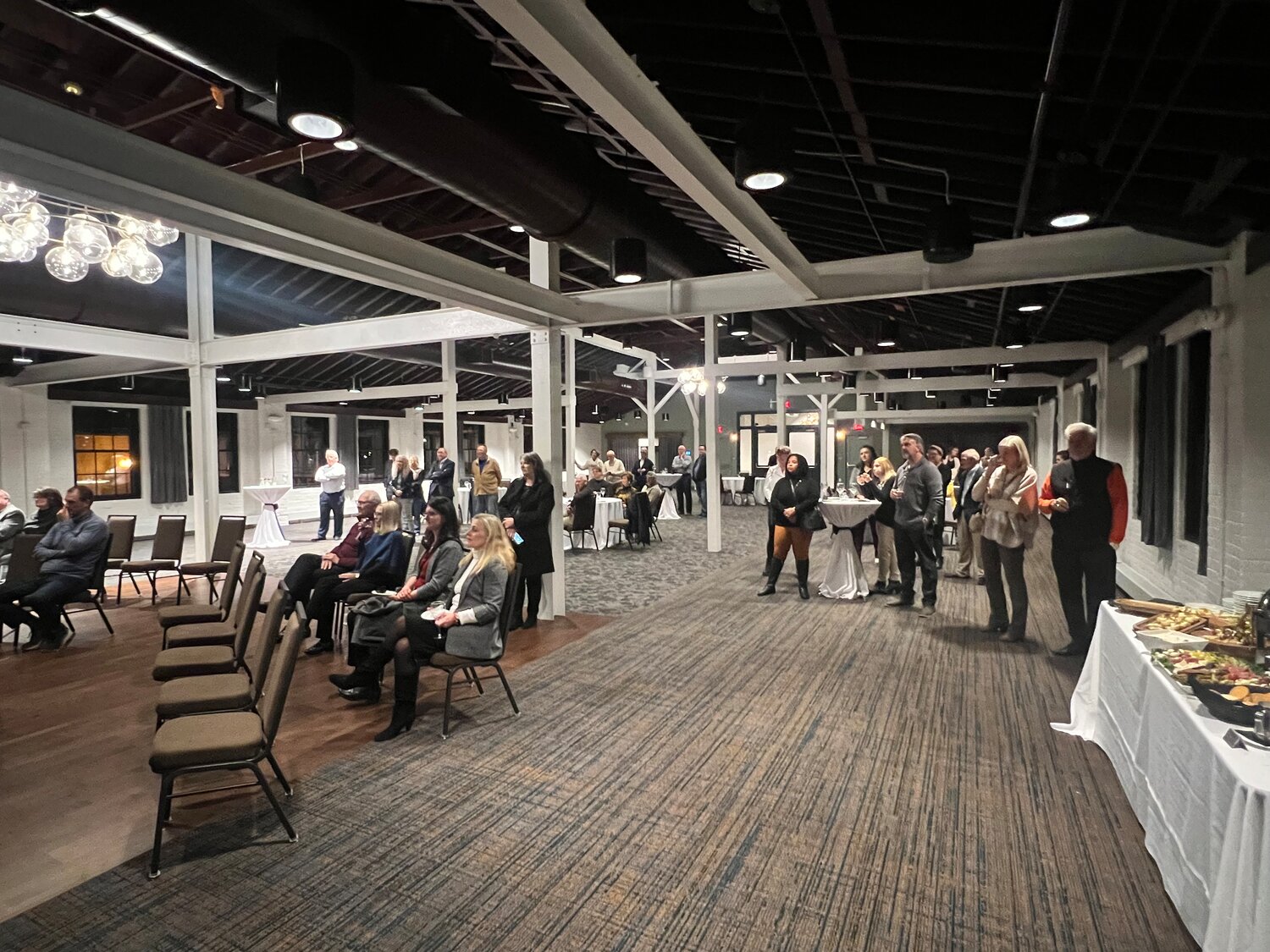 A crowd of current and former City of Hastings officials, councilmembers, HEDRA commissioners and grant partners attended a celebration of development of The Confluence in downtown Hastings Thursday night.