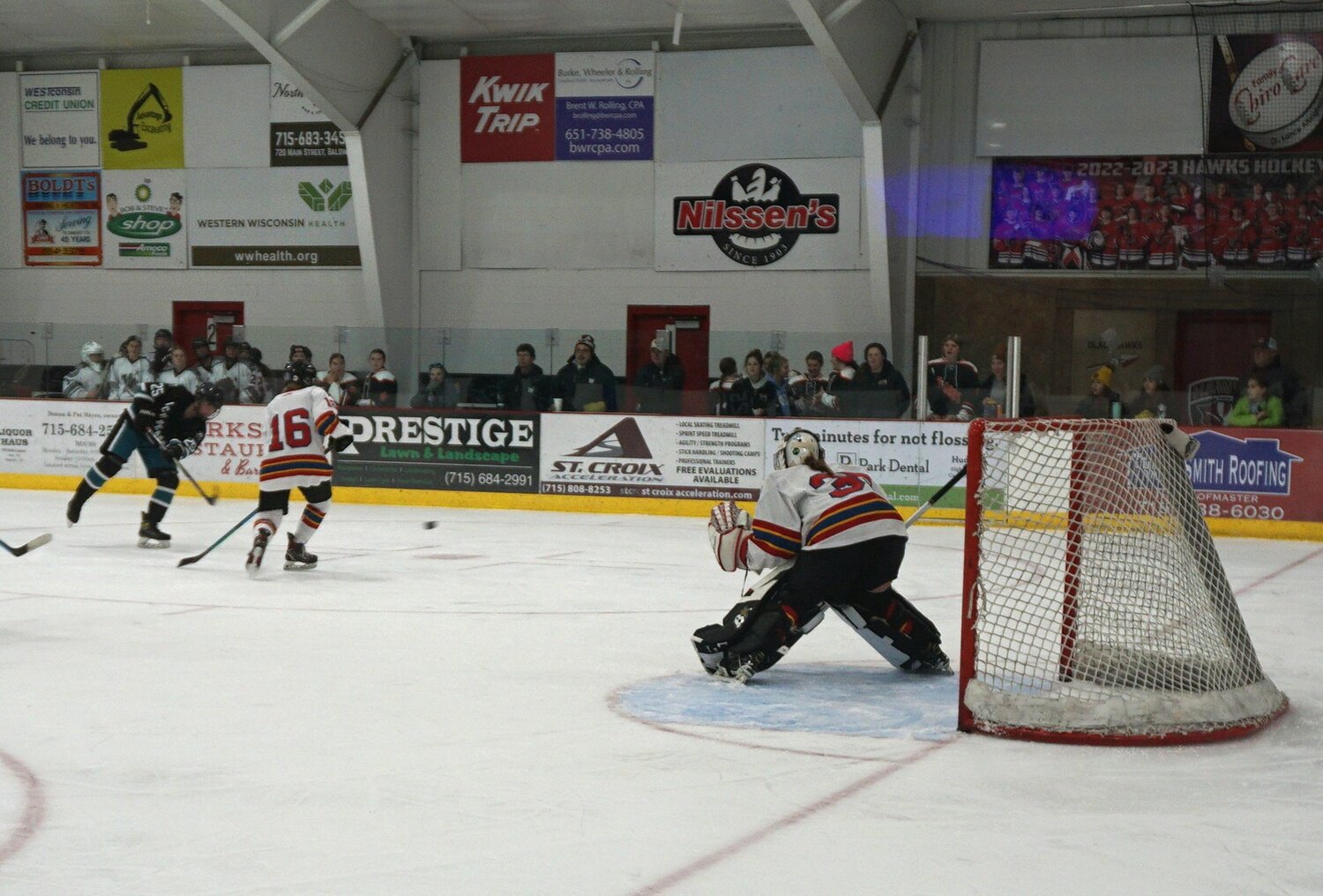 Fusion Goalie Anna Woolley sets up for the block against the Green Bay Area Ice Bears on Saturday in Baldwin.