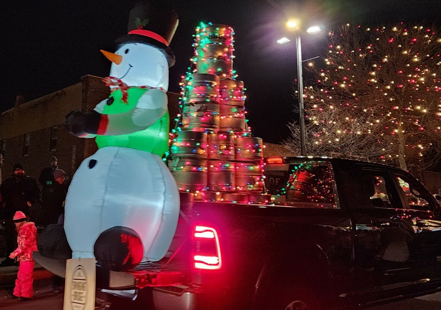 Frosty the Snowman was watching over beer barrels on this float in the River Dazzle parade, held on frigid Friday, Nov. 24 downtown River Falls.