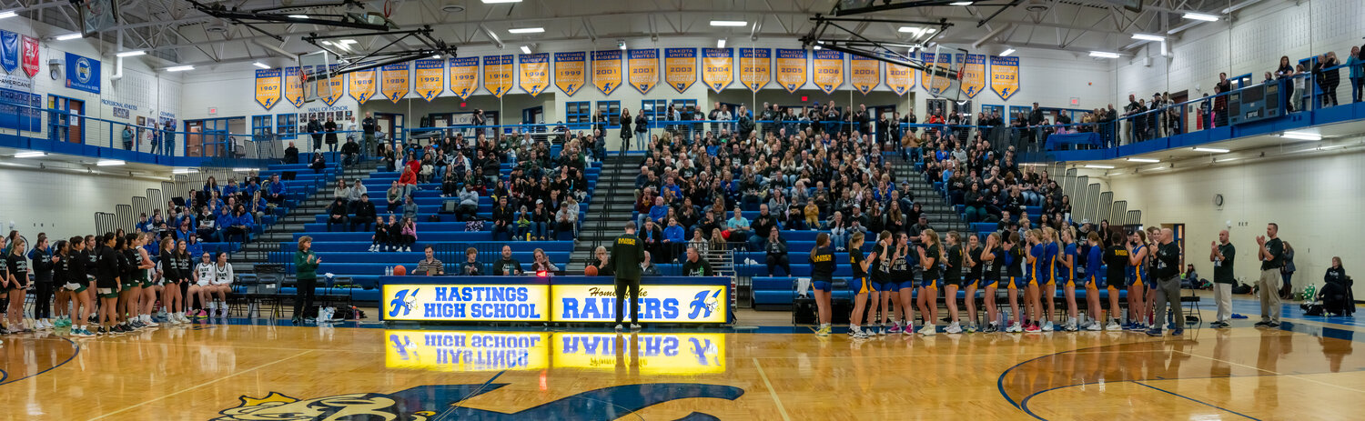Raider fans wore all black for the girls basketball season opener to honor Bill Ruder, a teacher and coach at the high school. Trent Hanson read an emotional statement from Bill just before the game started.