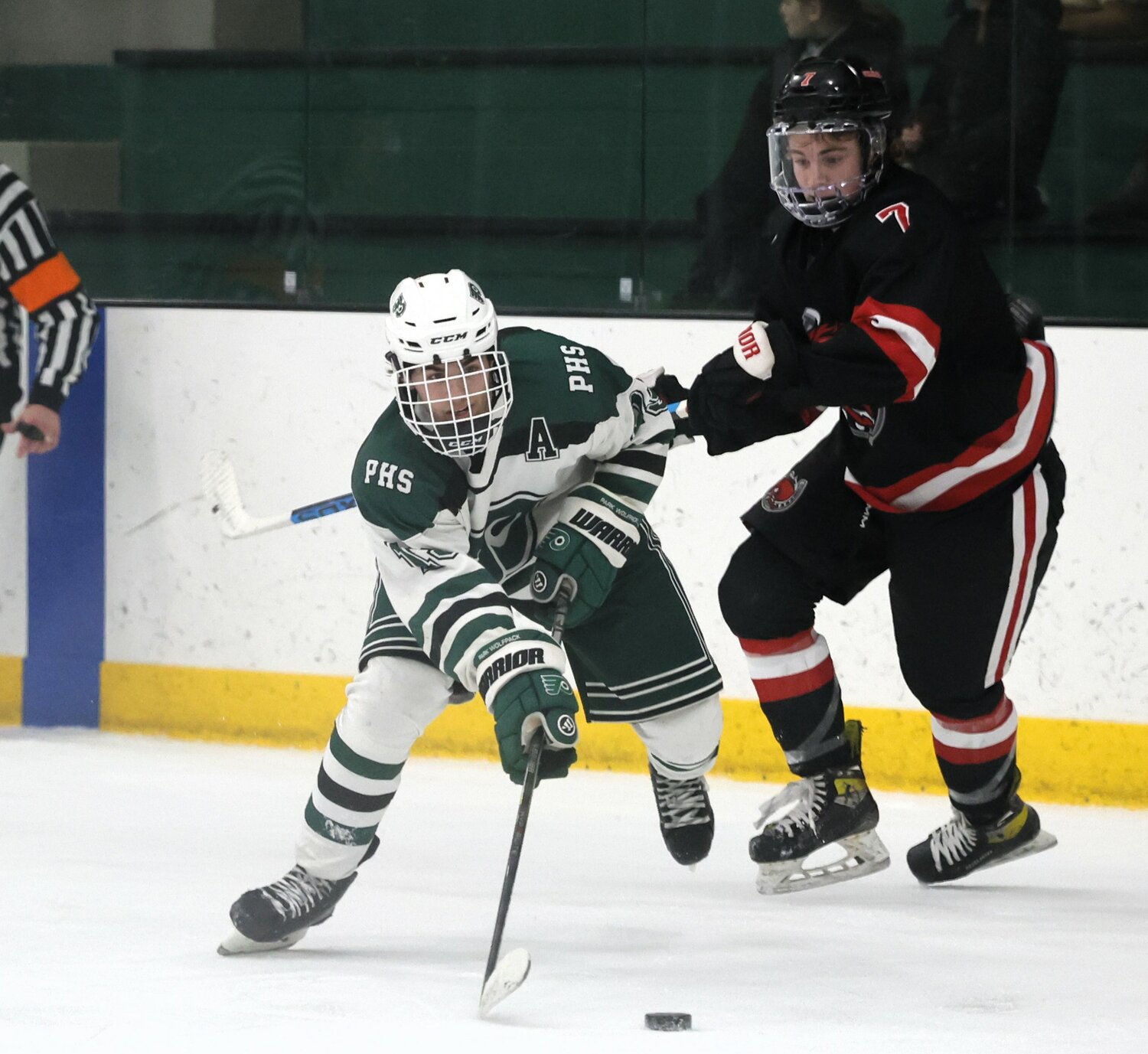 Gavin Moss of the Wolfpack moved the puck down the ice in the second period against Stillwater.