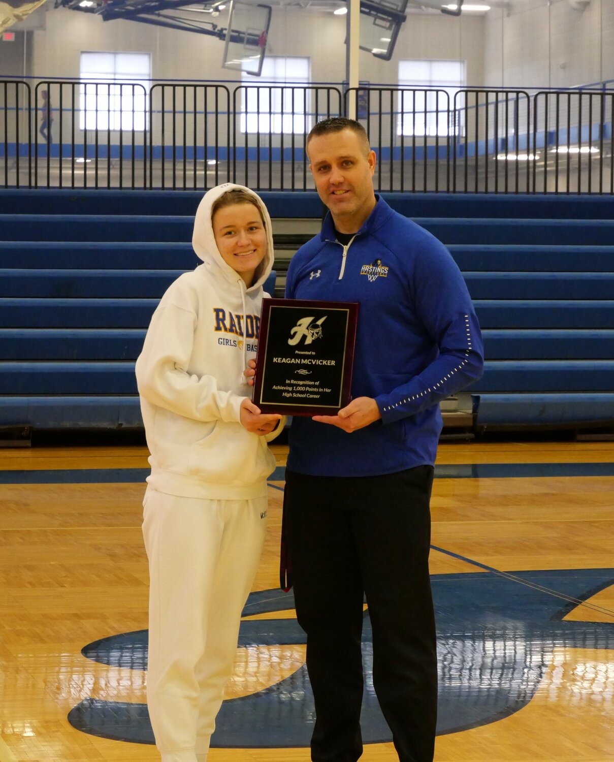 Keagan McVicker was presented a plaque marking 1,000 points in her Hastings Raider career by coach Rick Tavernier.