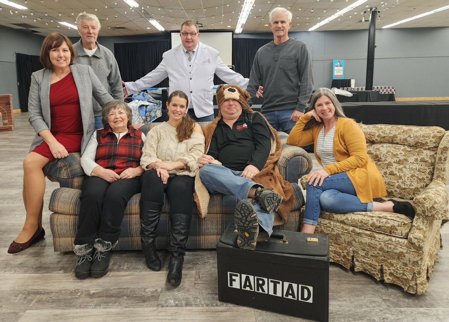 The cast of the Great River Road Theatre’s “Sin, Sex and the CIA” practice at The Old Ptacek’s Event Center. Pictured are (front, from left) Rebecca Denn, Judy Johnson, Krista Christiansen, Mark Andrle, Missy Kowalchyk; (back) Ken Roen, Aaron Denn, Scott Halverson. Not pictured: Marie-Anne Haudegand-Deiss.
