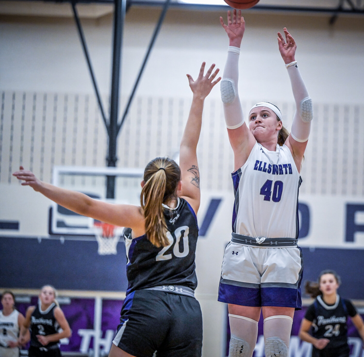 Morgan Halverson shoots over the top of a defender in the Panthers’ game against Durand earlier this season.